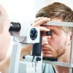 Optician examining a patient